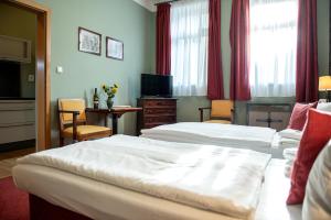 Postel nebo postele na pokoji v ubytování Residence Hattrick