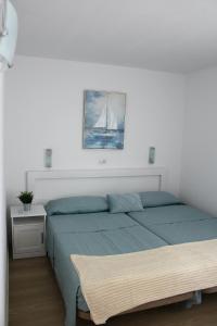 a bedroom with a bed with a sail on the wall at Canaima 308 in Puerto Rico de Gran Canaria +42 photos