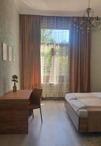 En eller flere senge i et værelse på ORI Vintage Beauty Apart Malul Muresului