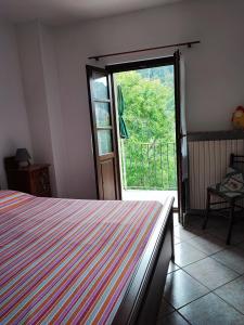 Postel nebo postele na pokoji v ubytování Casa vacanze a Macra