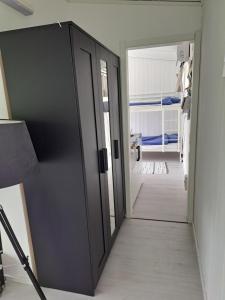 an open door in a room with a bedroom at Harmony in Farhult in Farhult