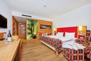 Ein Bett oder Betten in einem Zimmer der Unterkunft Asam Hotel