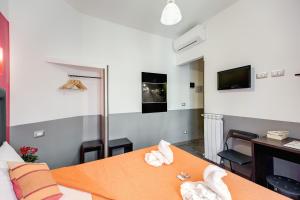 TV a/nebo společenská místnost v ubytování MF Hotel