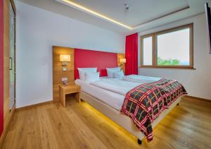 Ein Bett oder Betten in einem Zimmer der Unterkunft Asam Hotel