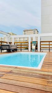 a swimming pool on the roof of a building at Hotel Metropole in Belo Horizonte