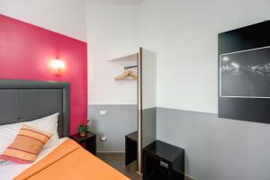 Postel nebo postele na pokoji v ubytování MF Hotel