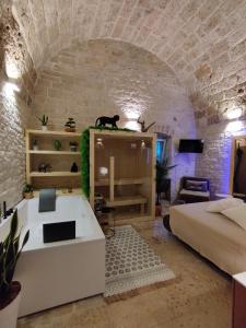 a room with a bed and a couch in a room at Alle volte Maison deluxe in Giovinazzo
