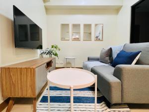 a living room with a couch and a table at 4 Majestic View in Iloilo City