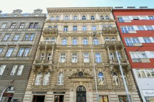 an old building in the city of paris at WSP Petrin Garden Apartments in Prague