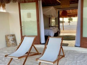 two chairs sitting in front of a room at LA DUNE DES SONGES in Anakao