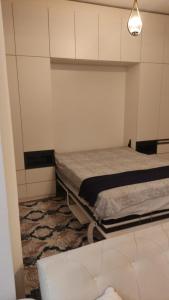 a bedroom with two beds and a rug at TOYA NEXT A206 in Istanbul