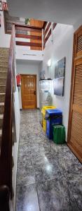 a room with a hallway with a counter and a door at Apartamentos América in Valle Gran Rey