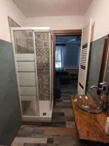 a bathroom with a shower and a sink at casa vacanze Villanova - 4 posti letto in Villanova