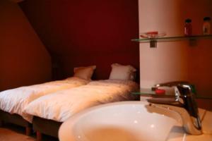 Postel nebo postele na pokoji v ubytování B&B Heerlijkhyd