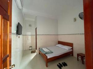 Postel nebo postele na pokoji v ubytování Nhà nghỉ Bình An - Binh An Motel
