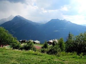 a view of a mountain range with houses and trees at Appartement Montvalezan-La Rosière, 2 pièces, 6 personnes - FR-1-398-564 in La Rosière