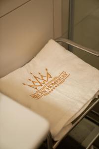 a towel on a bed in a hospital room at Helen Homestay Žižkov in Prague