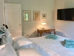 a bedroom with a bed with two pillows on it at Maison Montello in Varese