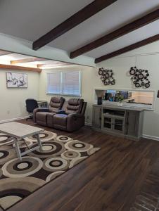 a living room with a couch and a table at Home away from home in Marietta