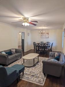 a living room with couches and a dining room at Home away from home in Marietta