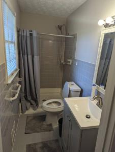 a bathroom with a toilet and a sink at Home away from home in Marietta