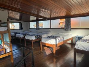 Postel nebo postele na pokoji v ubytování Maresia Hostel Paraty BR