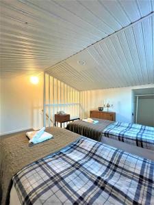 a room with two beds in a room at Entire modern home in Stockholm Kista - suitable for five persons in Stockholm