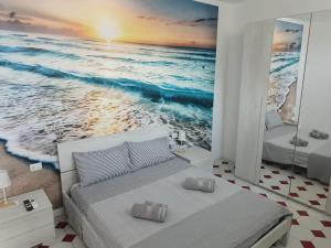 Postel nebo postele na pokoji v ubytování Nuovo bilocale a 100 mt dal mare