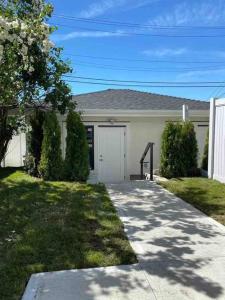 a house with a driveway in front of it at Four bedrooms New Lovely Duplex House-1628 in Vancouver