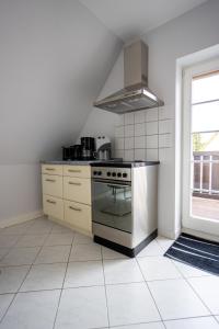 Kuchyň nebo kuchyňský kout v ubytování Ferienwohnung Gartenstadt Seilerberg + 12 fotografií