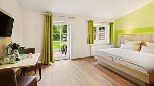 Postel nebo postele na pokoji v ubytování Hotel Deichinsel