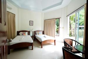 Voodi või voodid majutusasutuse Avare House Krabi toas