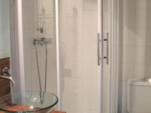 a shower with a glass bowl in a bathroom at Appartement Vars, 1 pièce, 2 personnes - FR-1-330B-149 in Vars