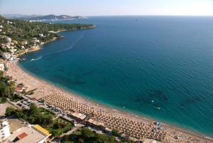 an aerial view of a beach with people in the water at Terasse by the sea in Sutomore +7 photos