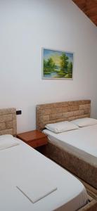 Postel nebo postele na pokoji v ubytování Hotel Lepenica