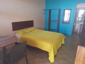 Postel nebo postele na pokoji v ubytování HOTEL Cabinas JACOMAR