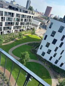 arial view of a building with a park in front of it at Bratislava Centrum, Ahoj park apartments, 6floor with balcony in Koliba