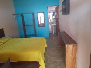 Postel nebo postele na pokoji v ubytování HOTEL Cabinas JACOMAR