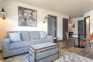 a living room with a couch and a table at MTN Lodge Ridgway in Ridgway