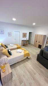 a large room with two beds and a couch at Luxury La Restinga in La Restinga +30 photos