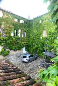 a car parked in front of a building at Chateau de Montcuquet in Lautrec