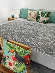 a bedroom with a bed with a black bird on it at Chagres River Lodge in Santa Rosa +85 photos