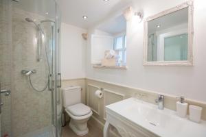 a bathroom with a toilet and a sink and a shower at Studio Apartments Sonatina in Dubrovnik