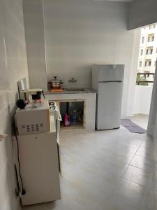 a kitchen with two refrigerators and a refrigerator at Super Appart T3 Tanger Mesnana in Tangier