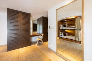 a room with a mirror and a bedroom with a bed at Selina Serenity Rawai Phuket in Rawai Beach +134 photos