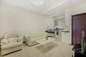 a living room with a couch and a table at Luxury Oceana Apartment, Central City Centre, Newly Refurbished in Plymouth
