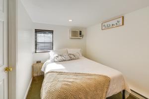 a small bedroom with a bed in a room at Long Island Studio Vacation Rental 4 Mi to Beach 