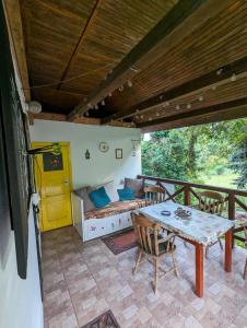 a living room with a table and a couch at Lóci Palócház in Nagylóc