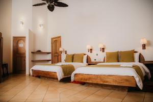 Postel nebo postele na pokoji v ubytování Arahuana Jungle Resort & Spa + 37 fotografií