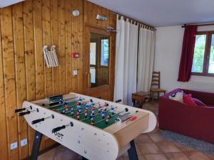 a living room with a foosball table at Chalet Montgenèvre, 7 pièces, 18 personnes - FR-1-266-184 in Montgenèvre